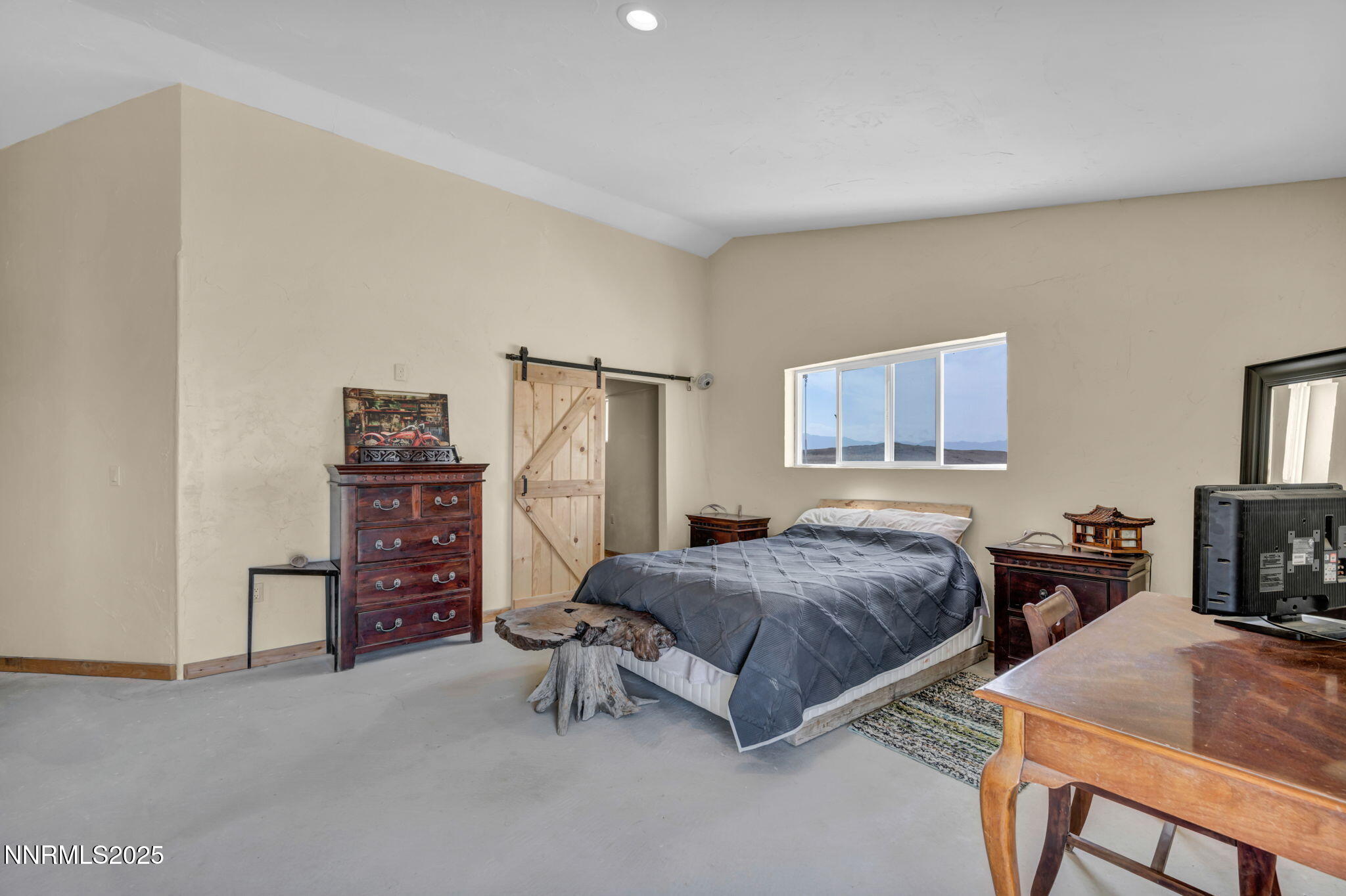 14995 Coal Canyon Road Lovelock, NV 89419 - Photo 19 of 37 a bedroom with a bed and a table in it