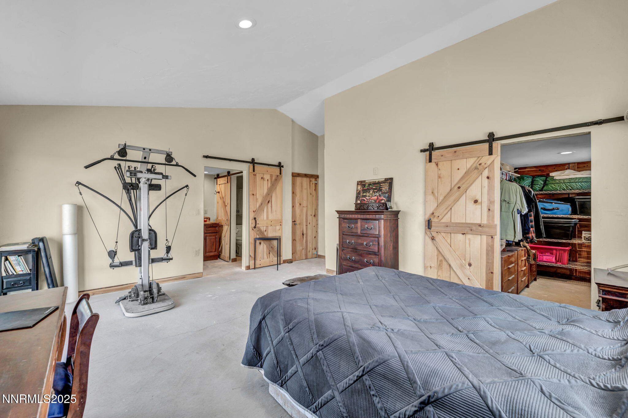 14995 Coal Canyon Road Lovelock, NV 89419 - Photo 20 of 37 a bedroom with a bed and a walk in closet