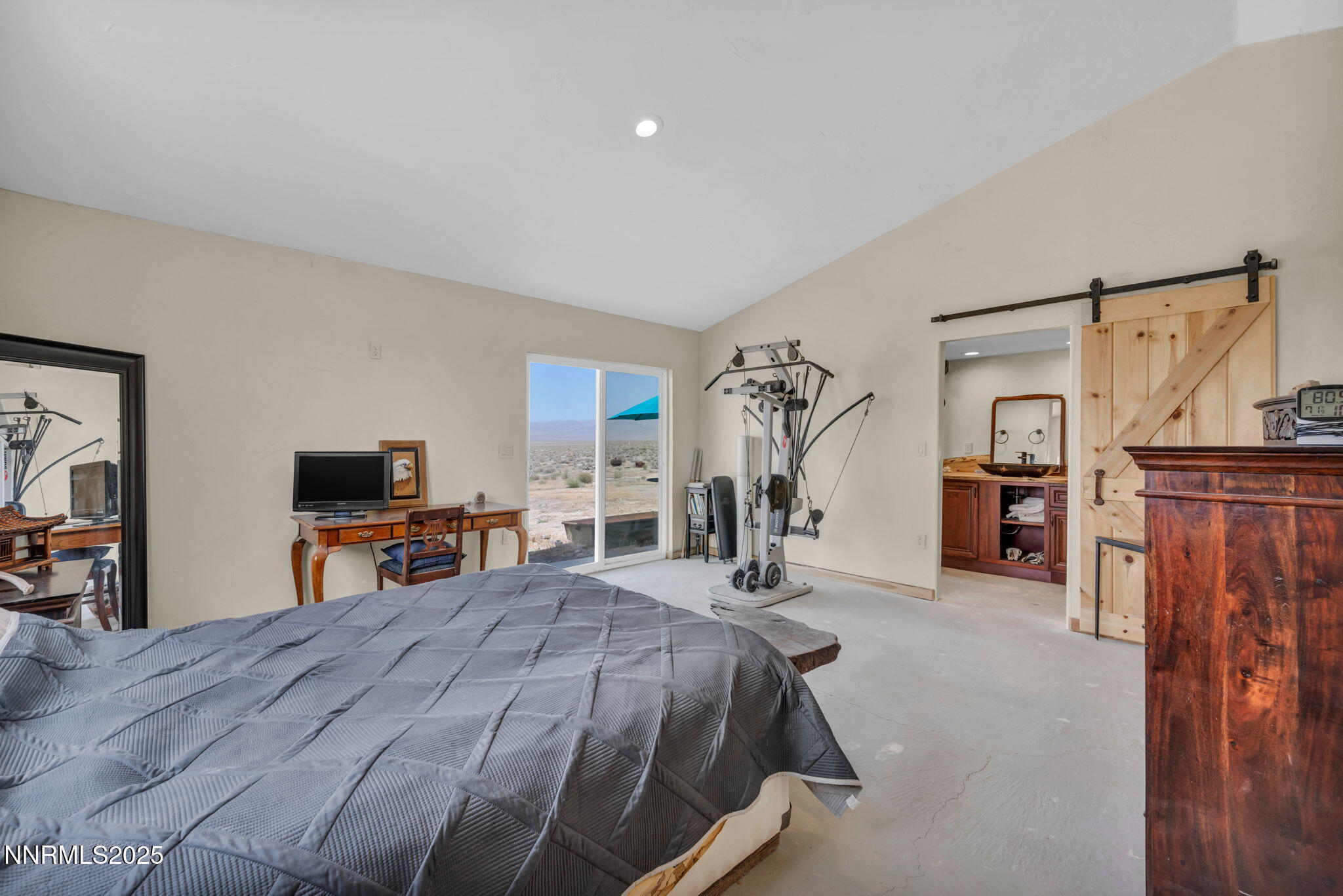 14995 Coal Canyon Road Lovelock, NV 89419 - Photo 21 of 37 a bedroom with a bed and a flat tv screen on a dresser