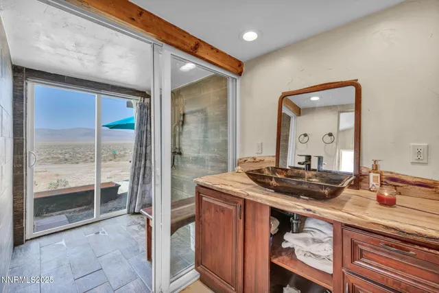 a kitchen with a sink and a wooden floor