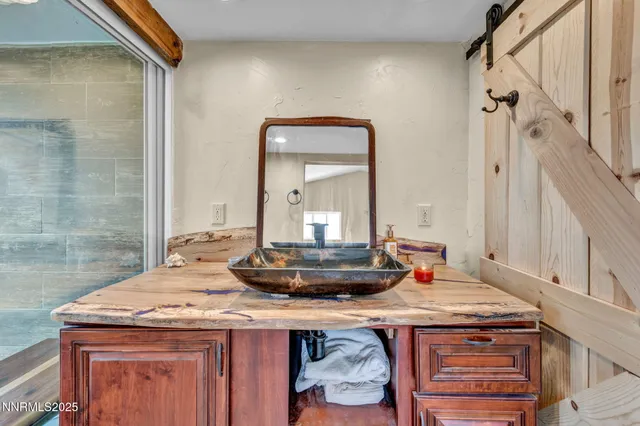 a room with a sink and a mirror