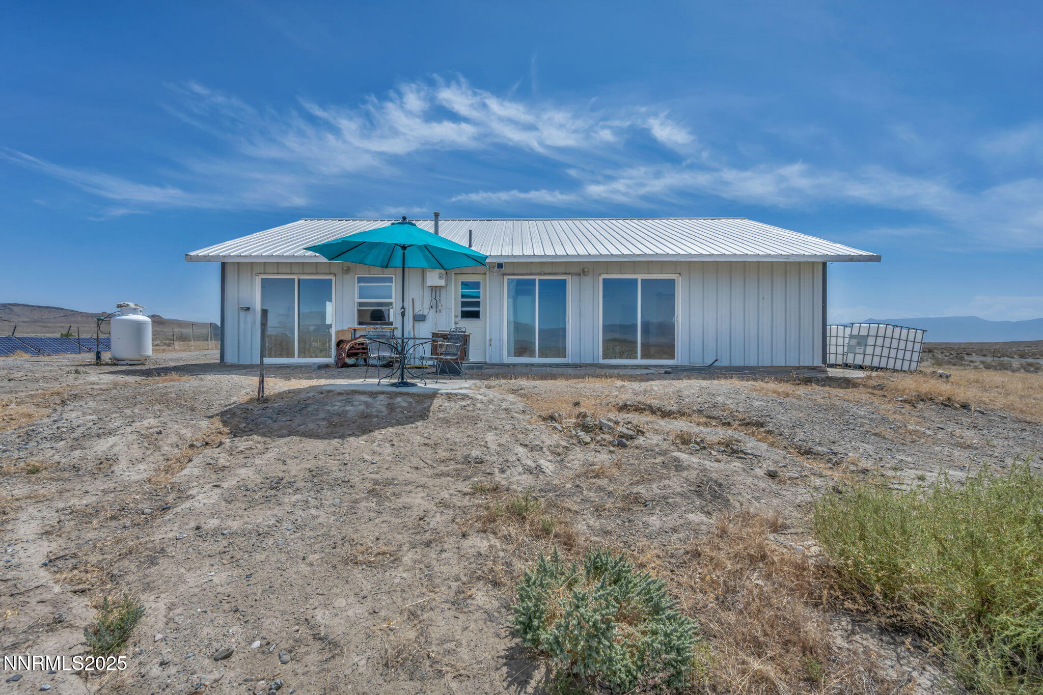 14995 Coal Canyon Road Lovelock, NV 89419 - Photo 29 of 37 a backyard of a house with yard and outdoor seating