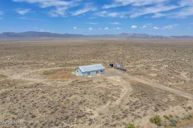 a view of an ocean beach and mountain