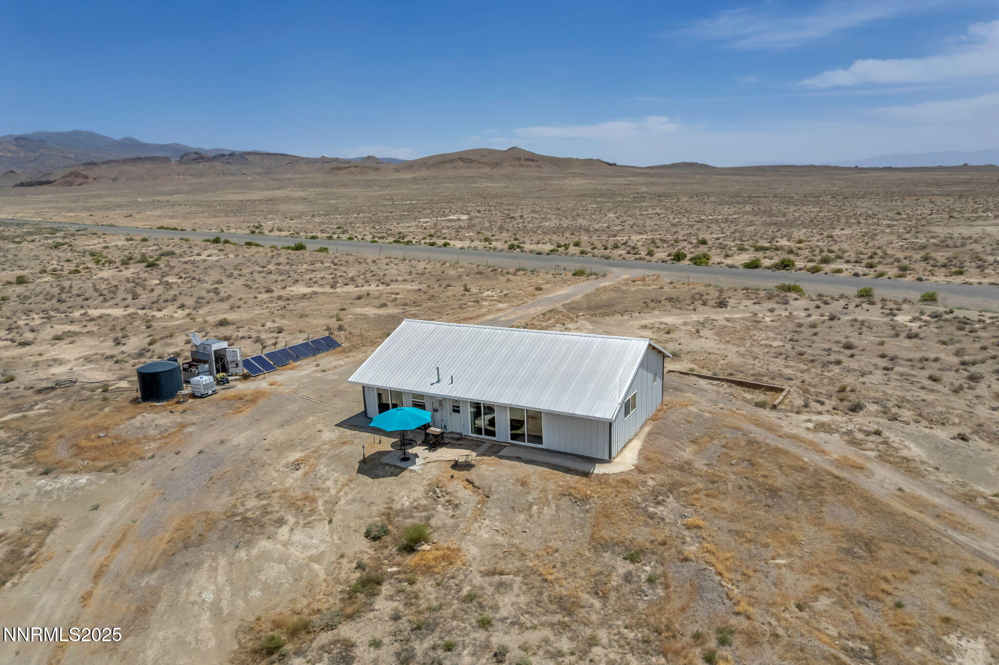 14995 Coal Canyon Road Lovelock, NV 89419 - Photo 36 of 37 an aerial view of a house with a yard and ocean view