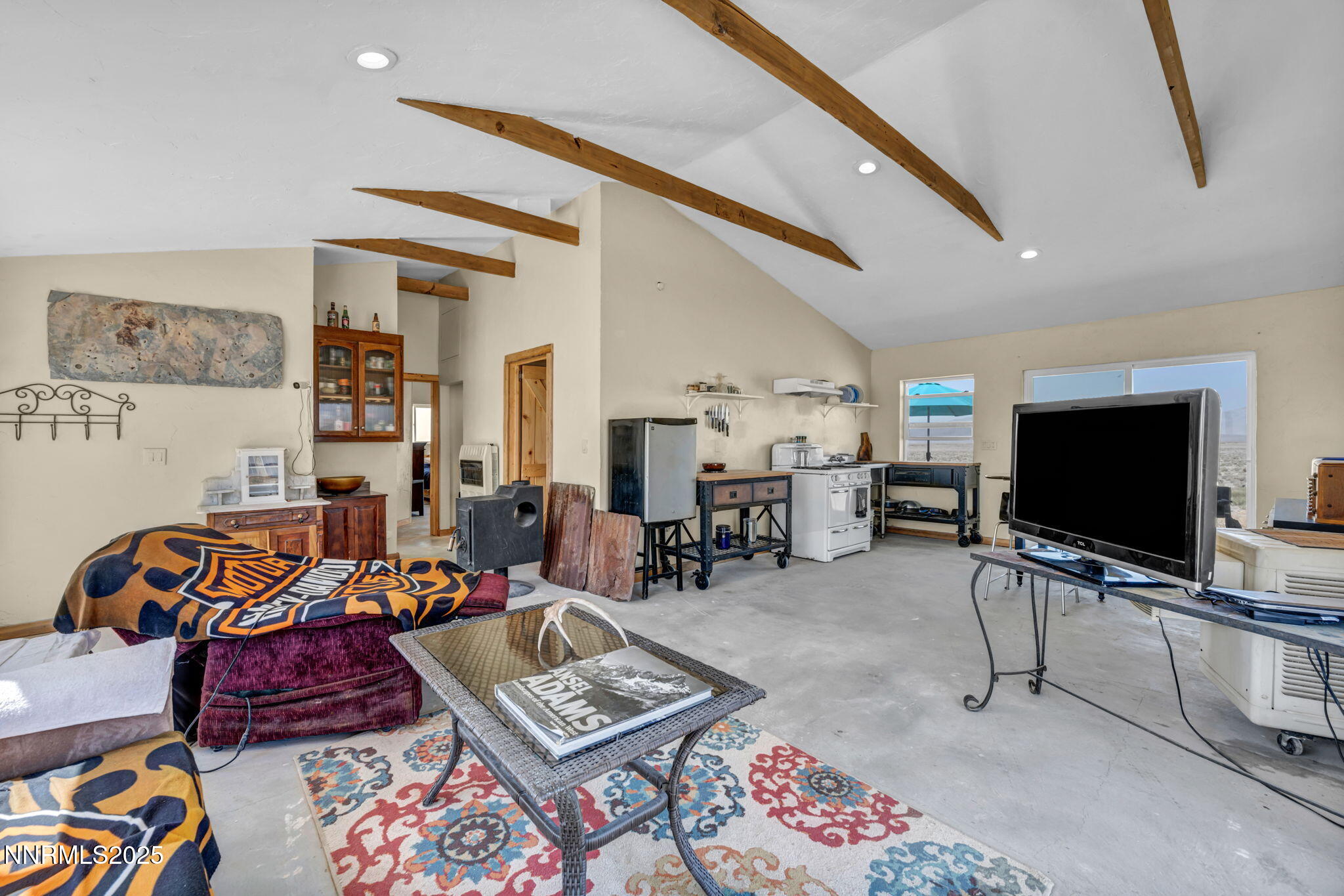 14995 Coal Canyon Road Lovelock, NV 89419 - Photo 4 of 37 a living room with furniture and a flat screen tv