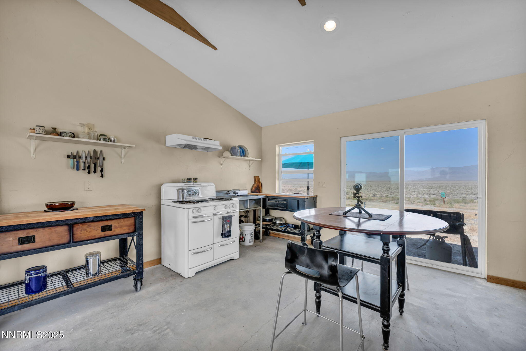 14995 Coal Canyon Road Lovelock, NV 89419 - Photo 8 of 37 a view of a dining room with furniture and a kitchen