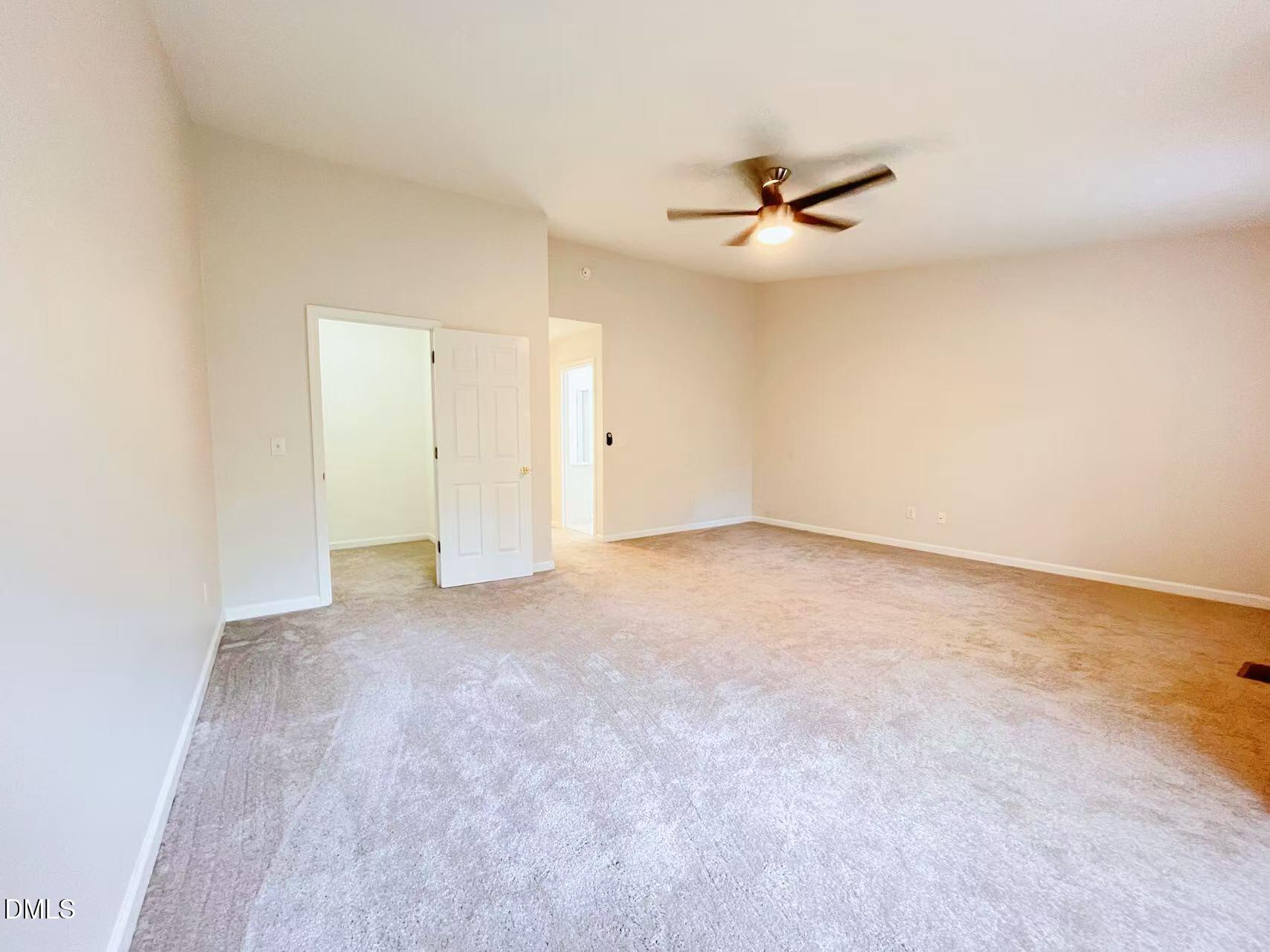 3040 Barrymore Street, Unit 108 Raleigh, NC 27603 - Photo 10 of 13 an empty room with closet and windows