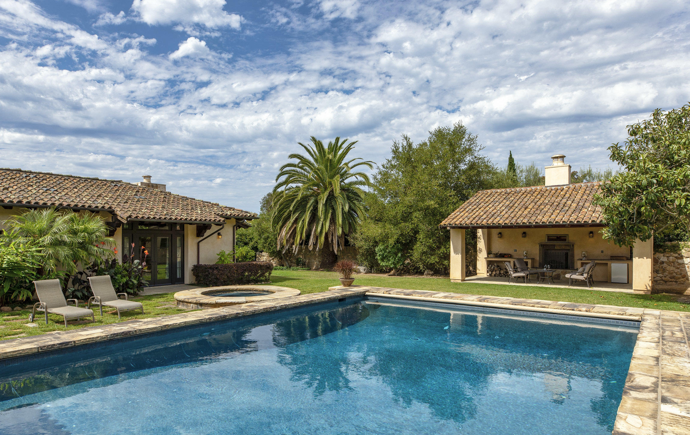 615 Hot Springs Road Montecito, CA 93108 - Photo 11 of 23 a swimming pool with outdoor seating and yard