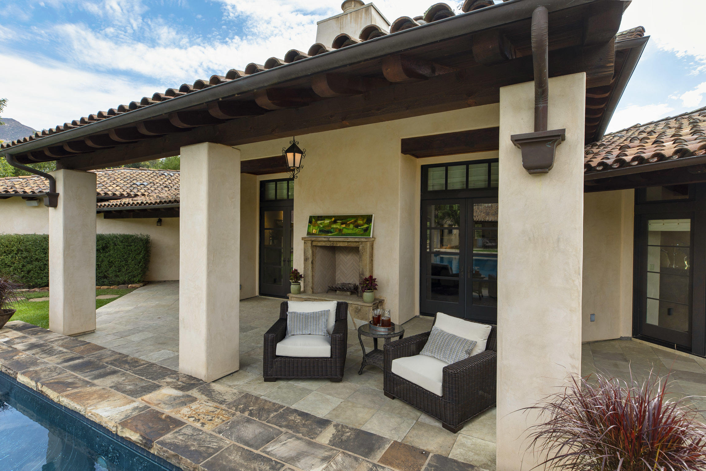 615 Hot Springs Road Montecito, CA 93108 - Photo 12 of 23 a view of a patio with couches chairs and potted plants