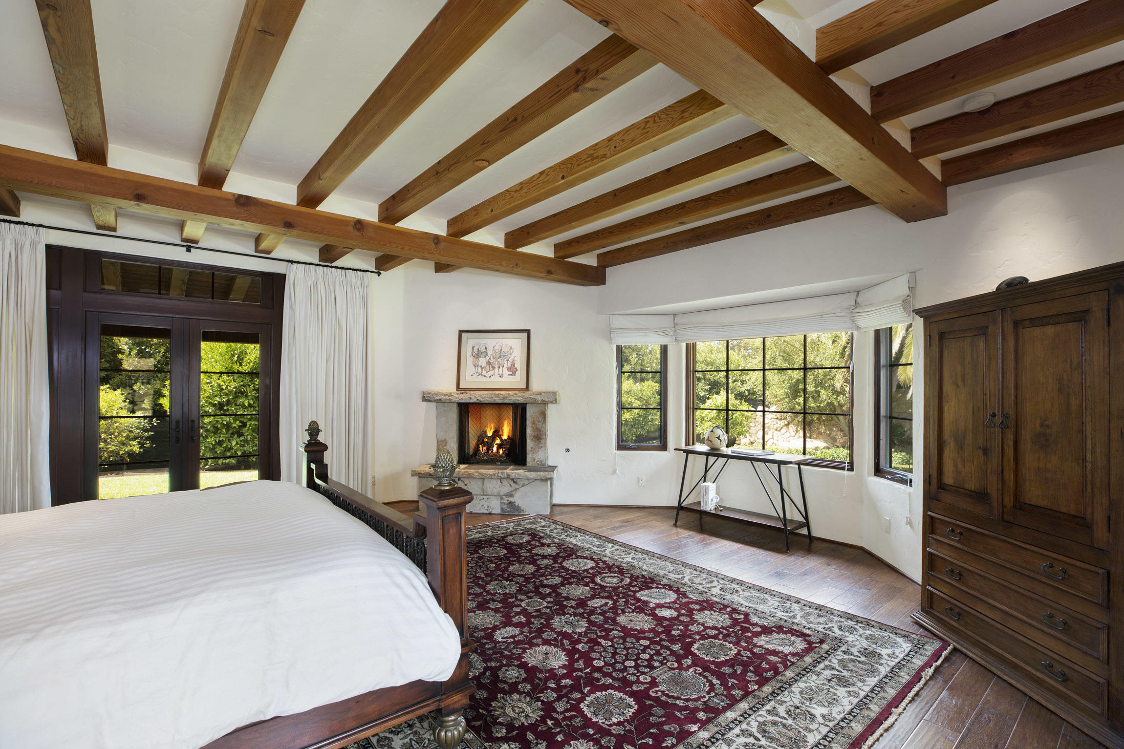 615 Hot Springs Road Montecito, CA 93108 - Photo 15 of 23 a bed sitting in a spacious bedroom next to a window