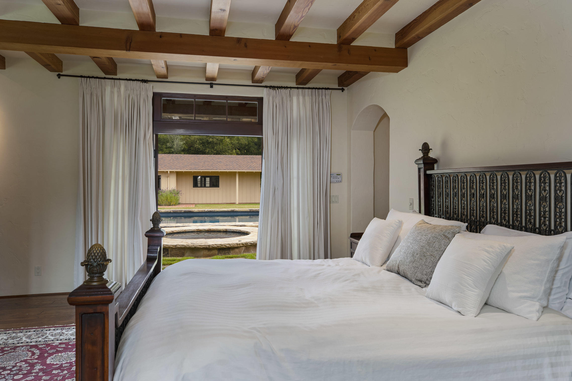 615 Hot Springs Road Montecito, CA 93108 - Photo 16 of 23 a bedroom with a bed and a window