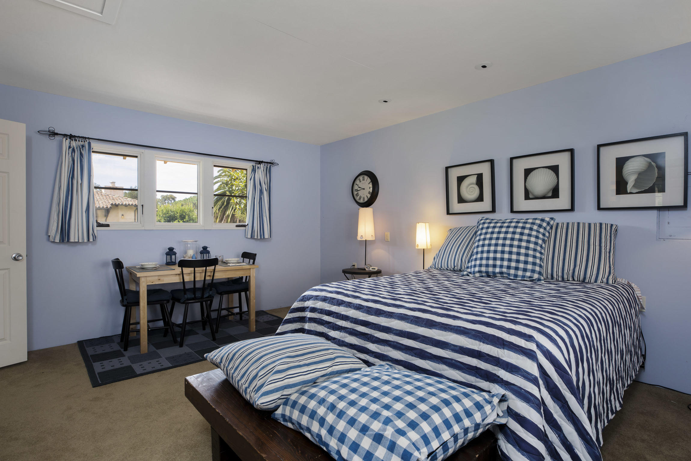 615 Hot Springs Road Montecito, CA 93108 - Photo 20 of 23 a bedroom with a bed and a table in it