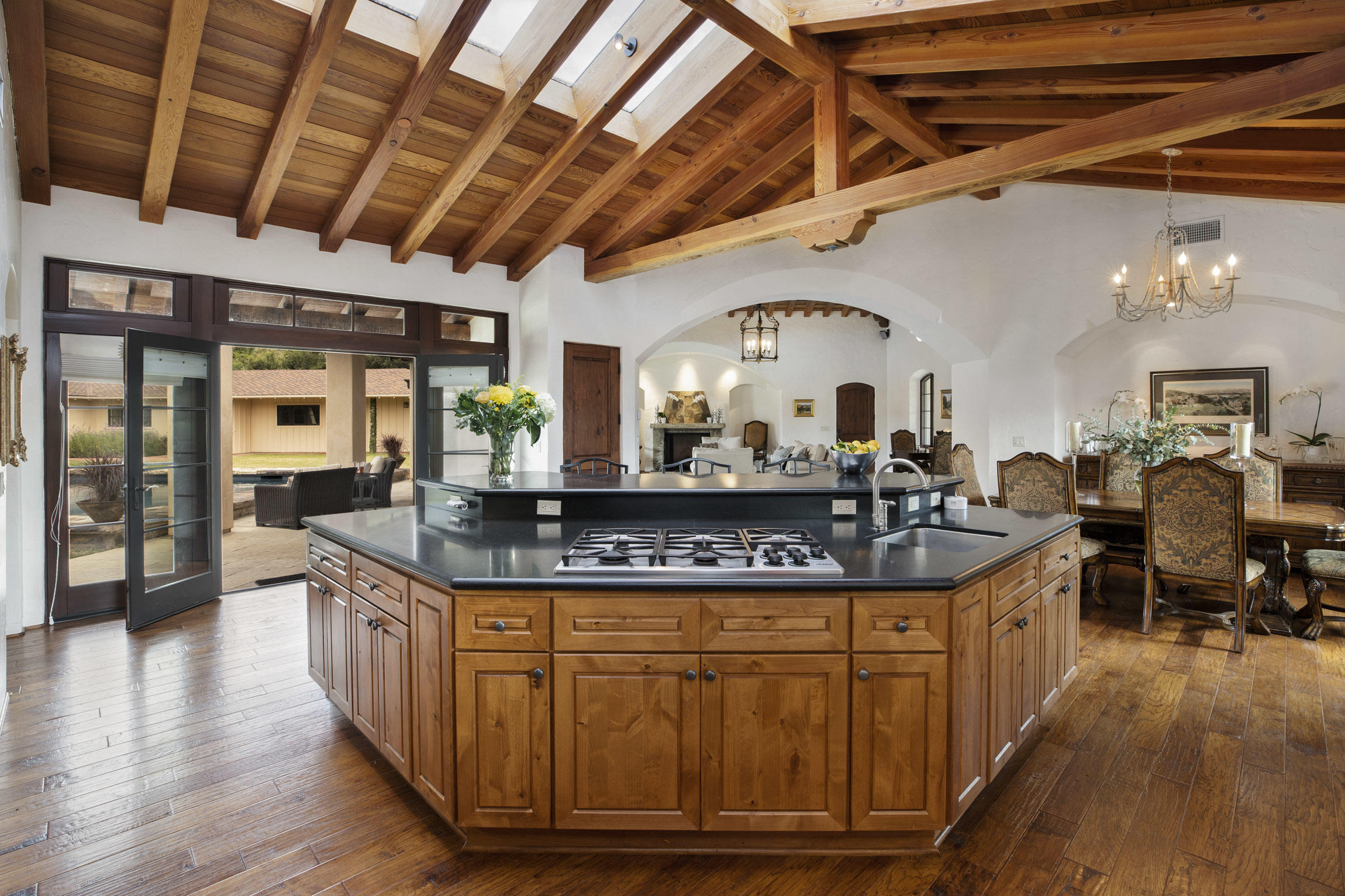 615 Hot Springs Road Montecito, CA 93108 - Photo 7 of 23 a kitchen with stainless steel appliances granite countertop a stove a sink dishwasher and cabinets with wooden floor