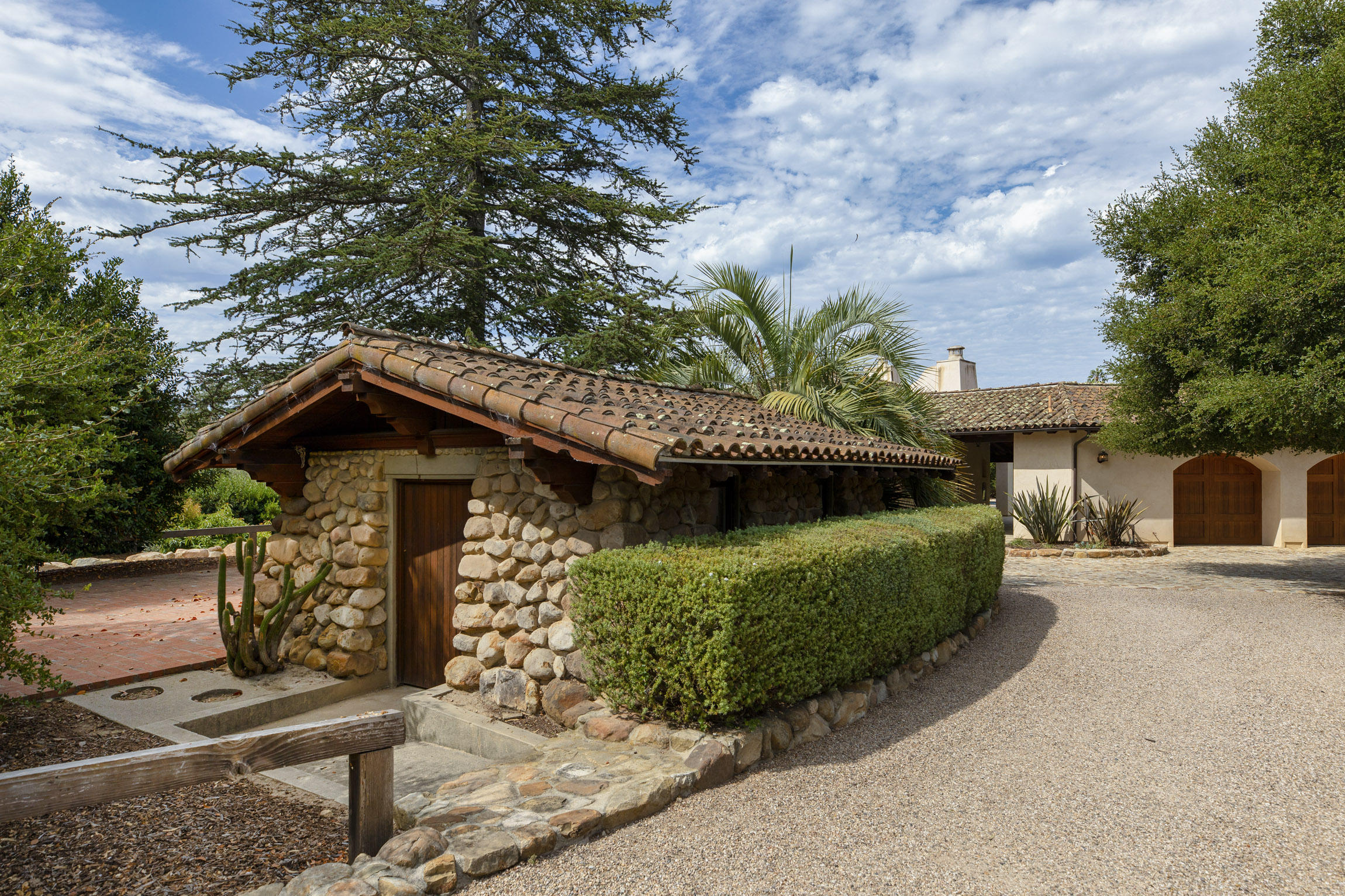 615 Hot Springs Road Montecito, CA 93108 - Photo 9 of 23 a front view of a house with garden