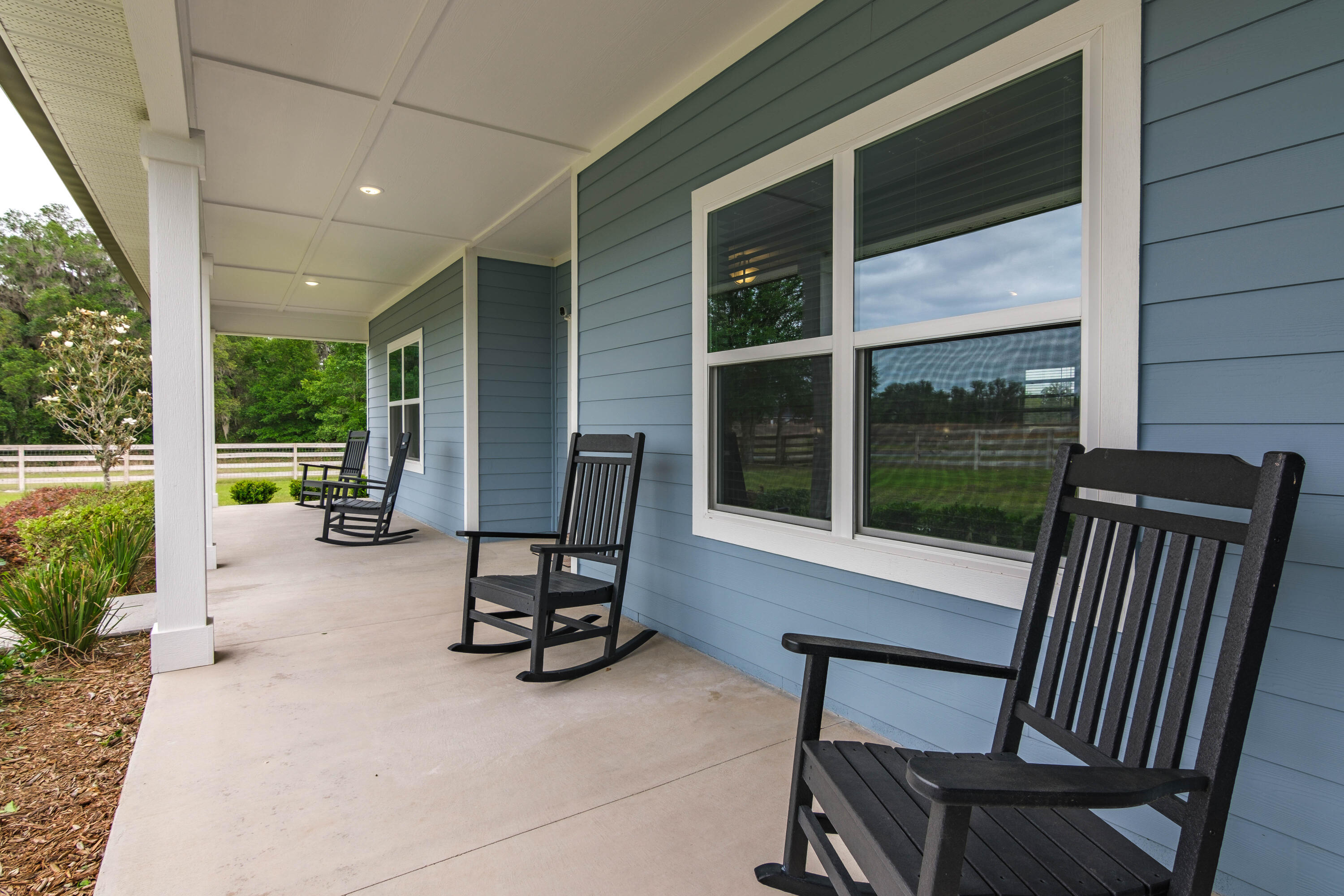 10172 98th Street, Unit 2 Live Oak, FL 32060 - Photo 13 of 37 a view of a patio with a table and chairs