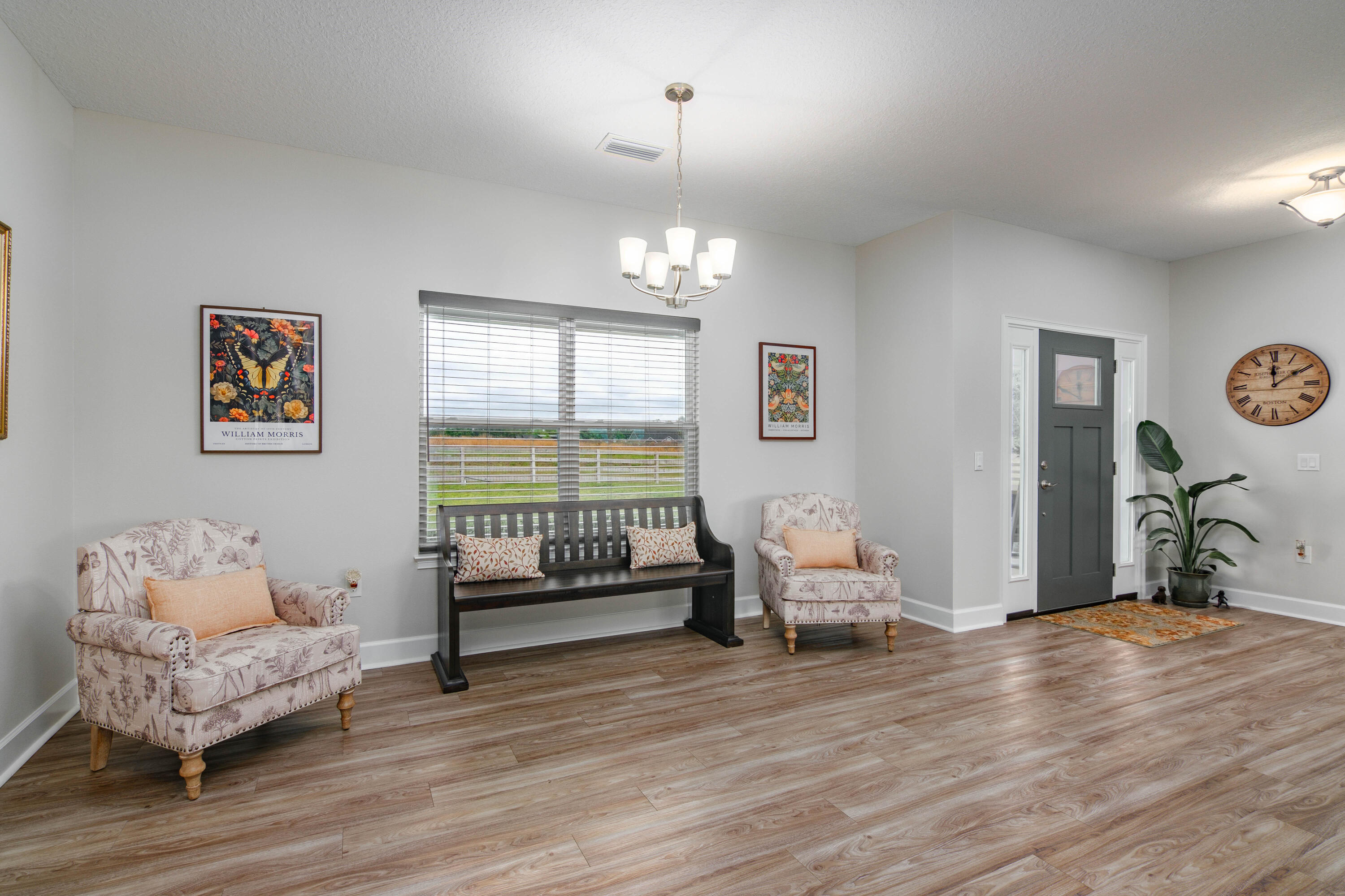 10172 98th Street, Unit 2 Live Oak, FL 32060 - Photo 16 of 37 a bedroom with furniture and wooden floor