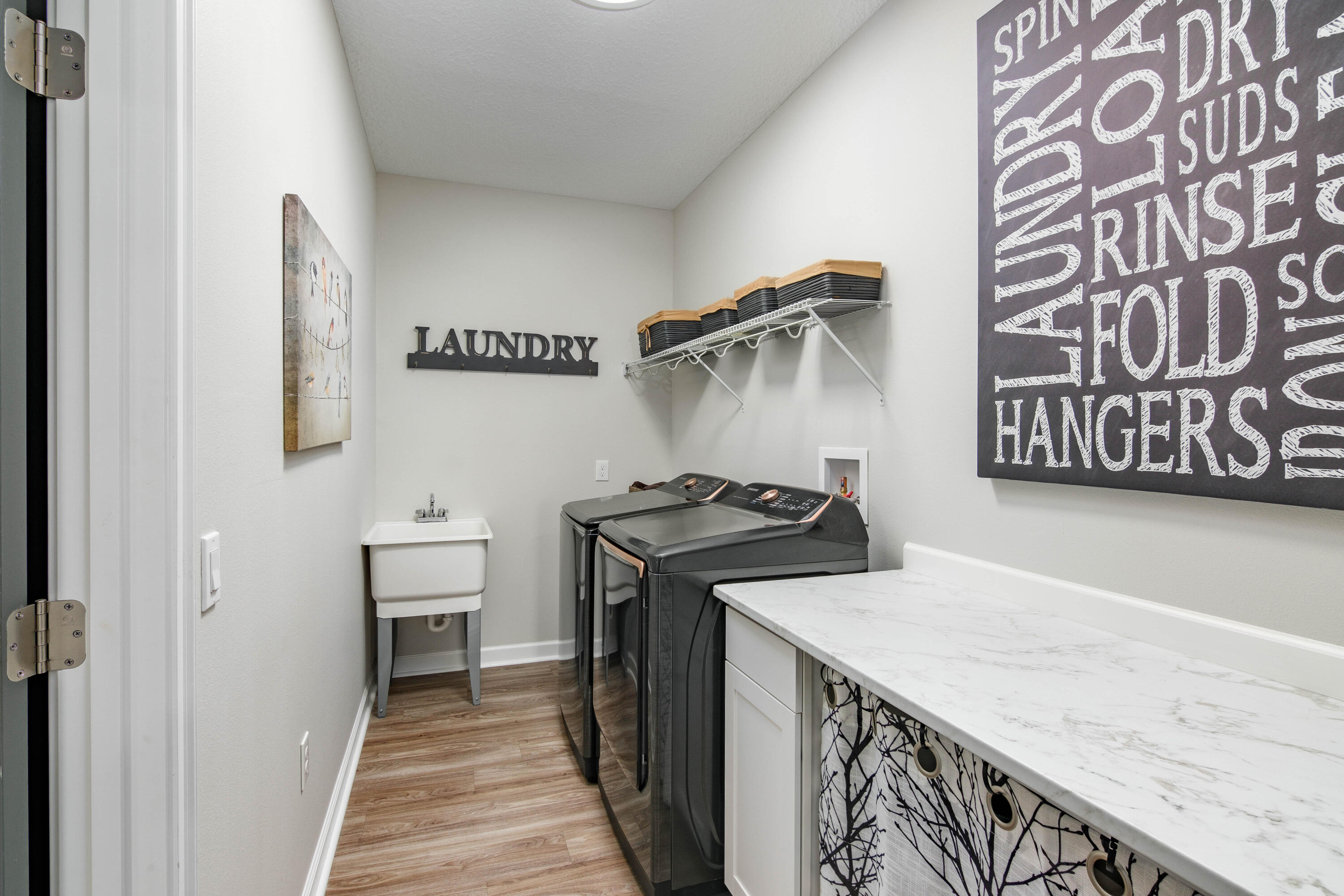 10172 98th Street, Unit 2 Live Oak, FL 32060 - Photo 17 of 37 a utility room with a sink a washer and dryer