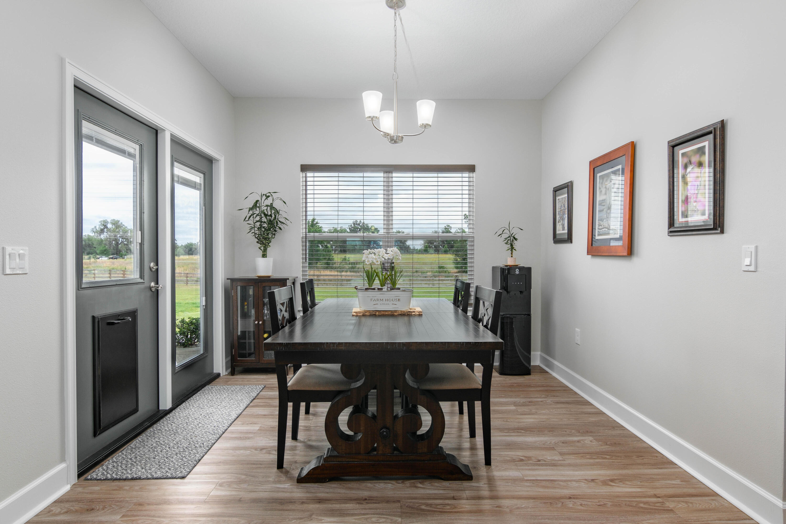 10172 98th Street, Unit 2 Live Oak, FL 32060 - Photo 20 of 37 a view of a dining room with furniture window and wooden floor