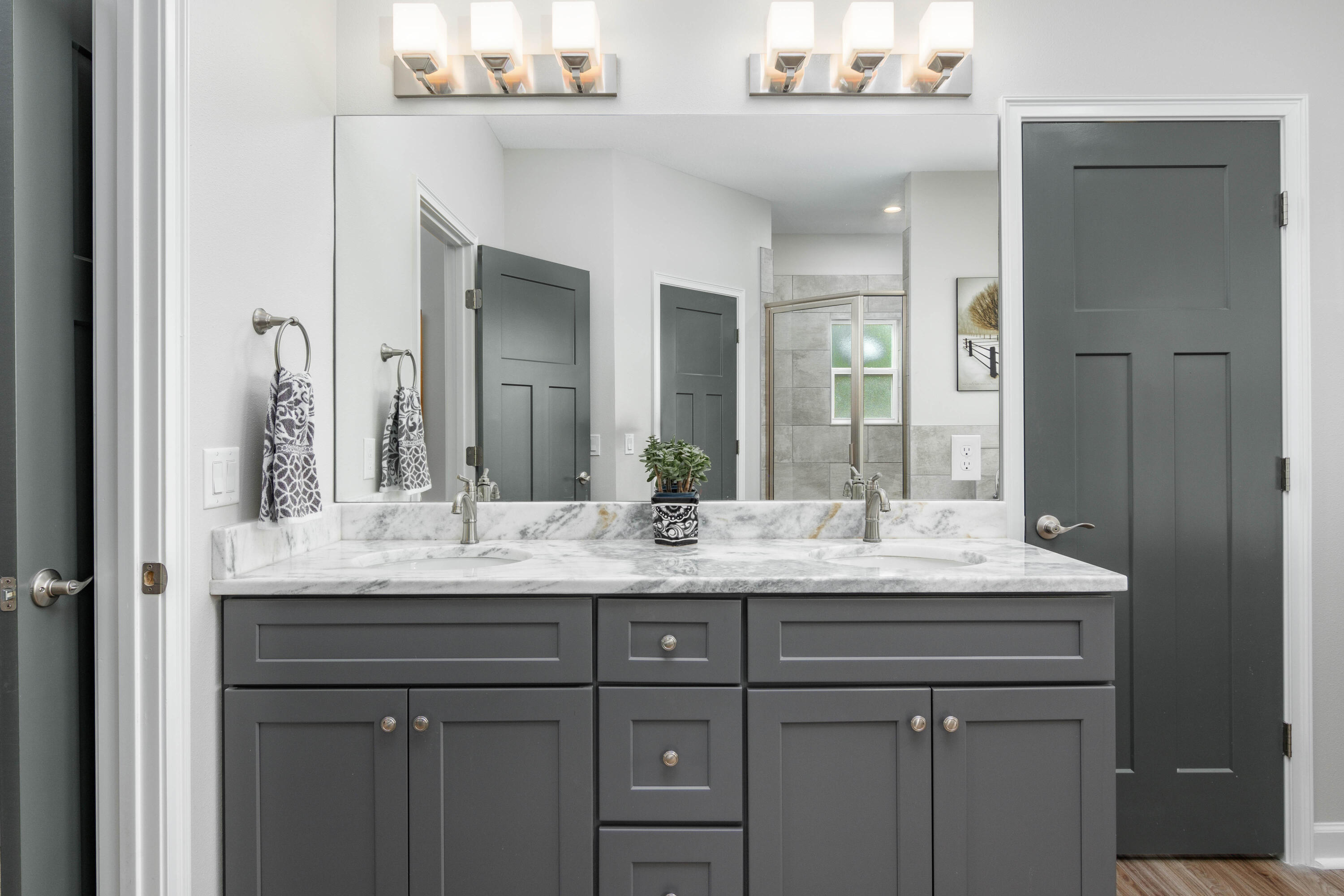 10172 98th Street, Unit 2 Live Oak, FL 32060 - Photo 25 of 37 a bathroom with a granite countertop sink and a mirror