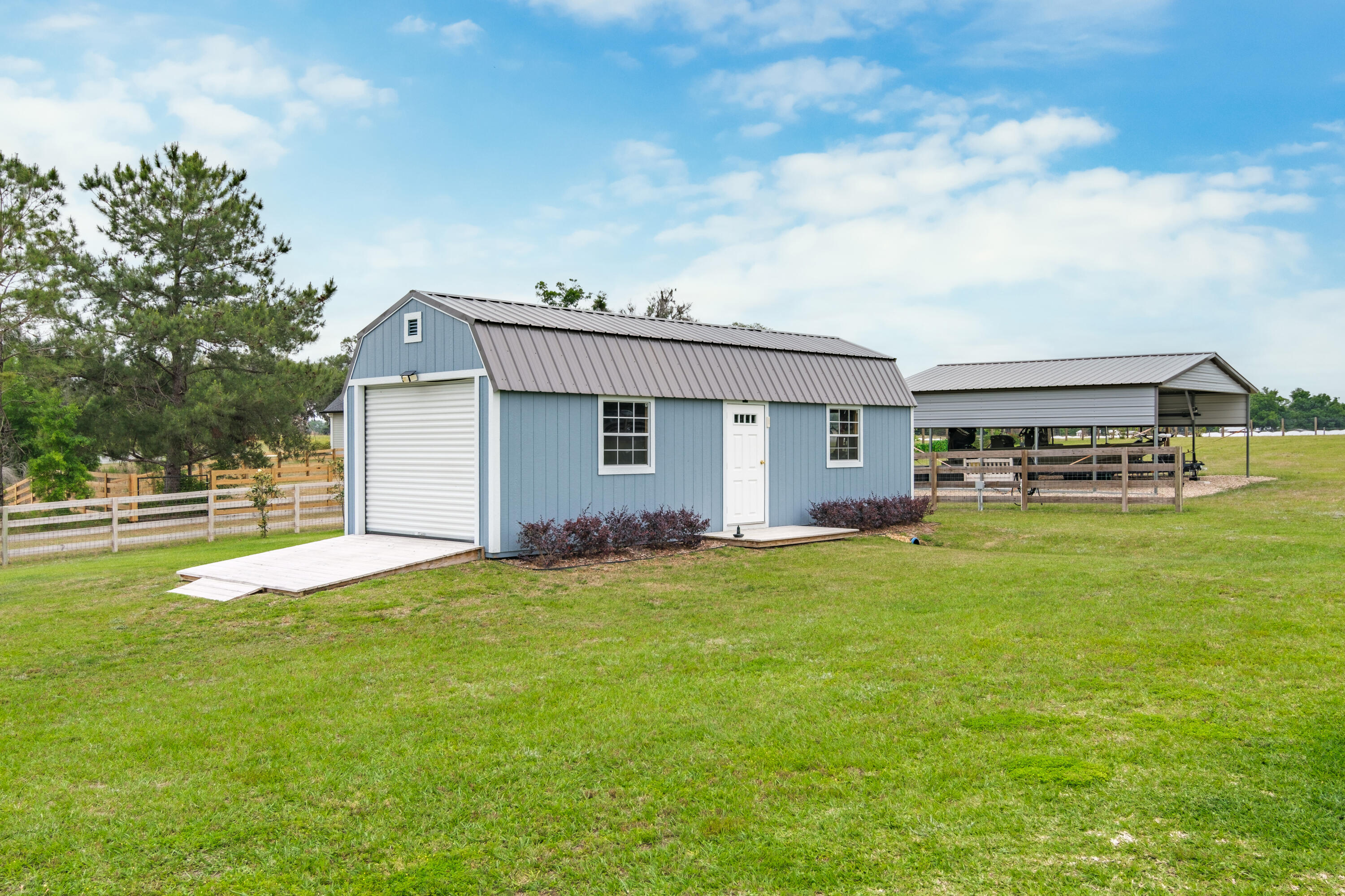 10172 98th Street, Unit 2 Live Oak, FL 32060 - Photo 9 of 37 a view of a house with a backyard