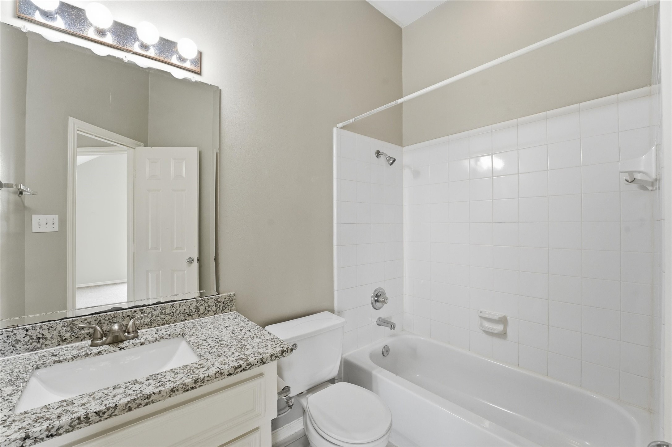 1507 Sutton Street Houston, TX 77006 - Photo 23 of 31 a bathroom with a granite countertop sink toilet and shower