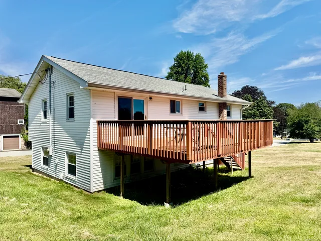 a view of a house with a backyard