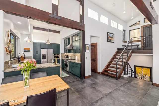 a kitchen with furniture and a stove