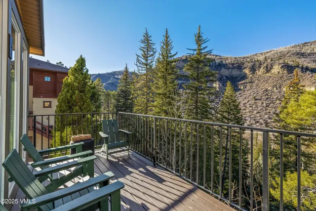 a view of a balcony with chairs