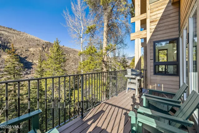 a view of a balcony with wooden floor