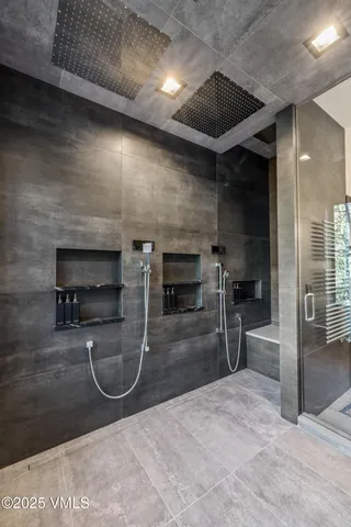 a kitchen with stainless steel appliances kitchen island granite countertop a stove and a sink