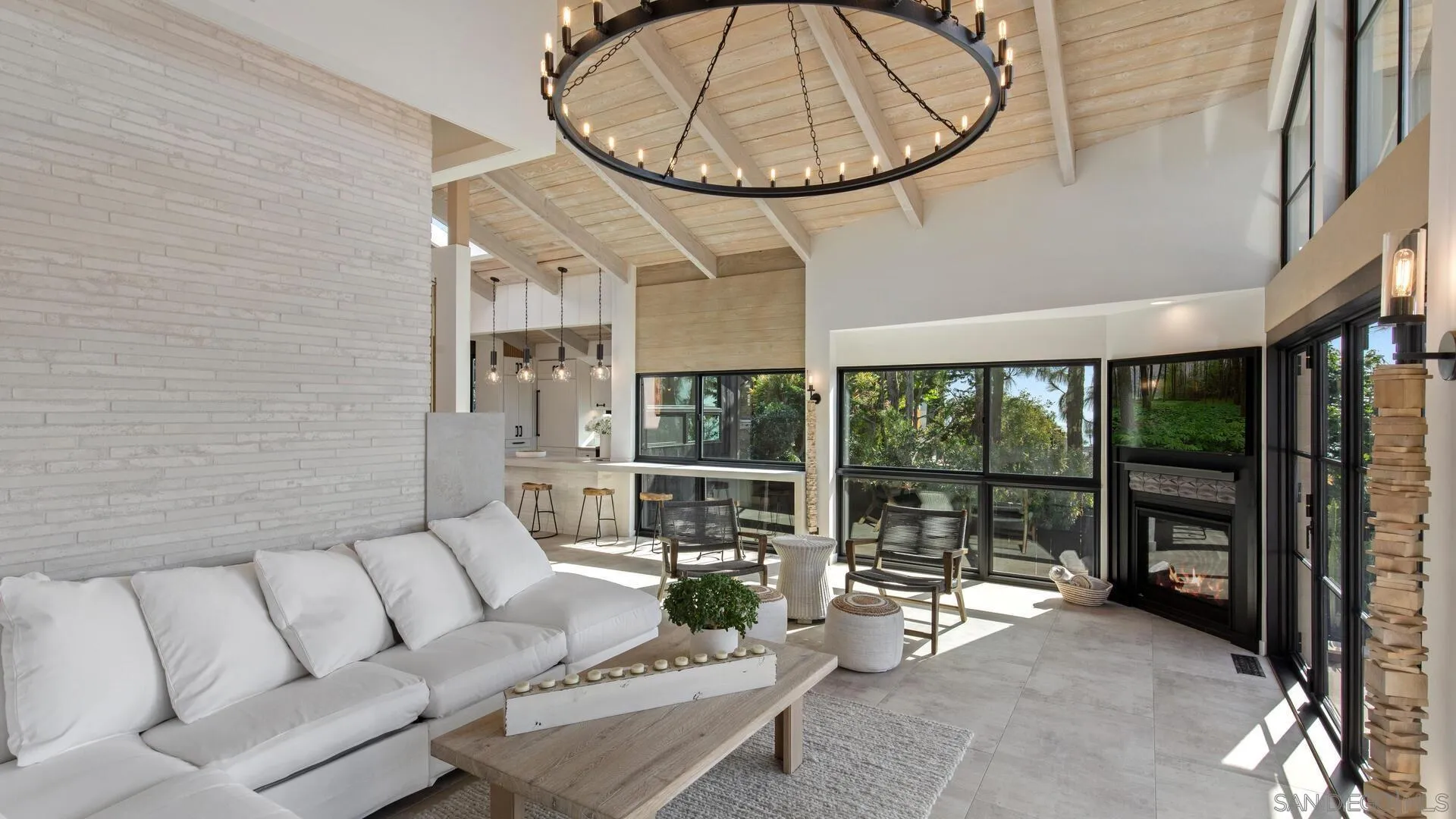 340 7th Street Del Mar, CA 92014 - Photo 8 of 30 a living room with furniture a large window and a chandelier