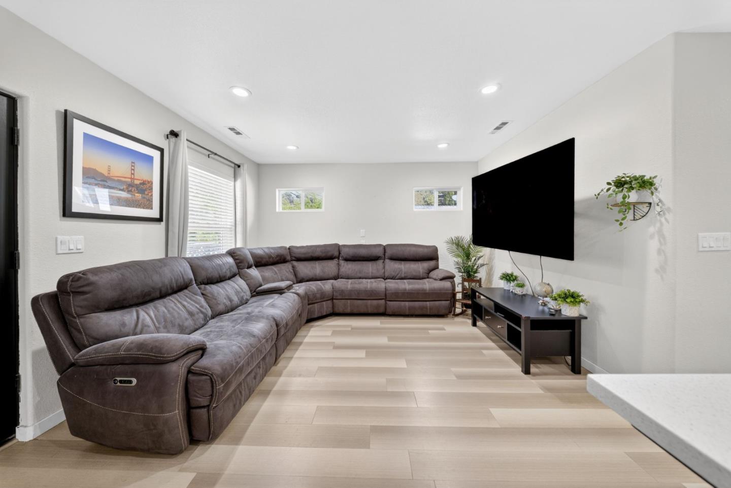 919 Old Canyon Road Fremont, CA 94536 - Photo 5 of 55 a living room with furniture and a flat screen tv