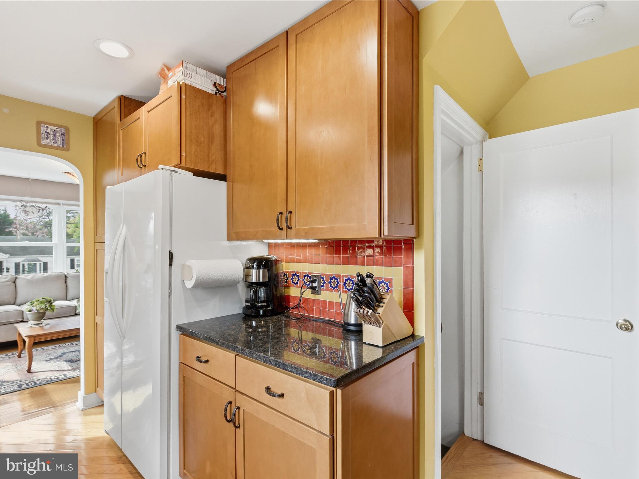 2707 Lindell Street Silver Spring, MD 20902 - Photo 11 of 51 a kitchen with stainless steel appliances granite countertop a refrigerator and a stove