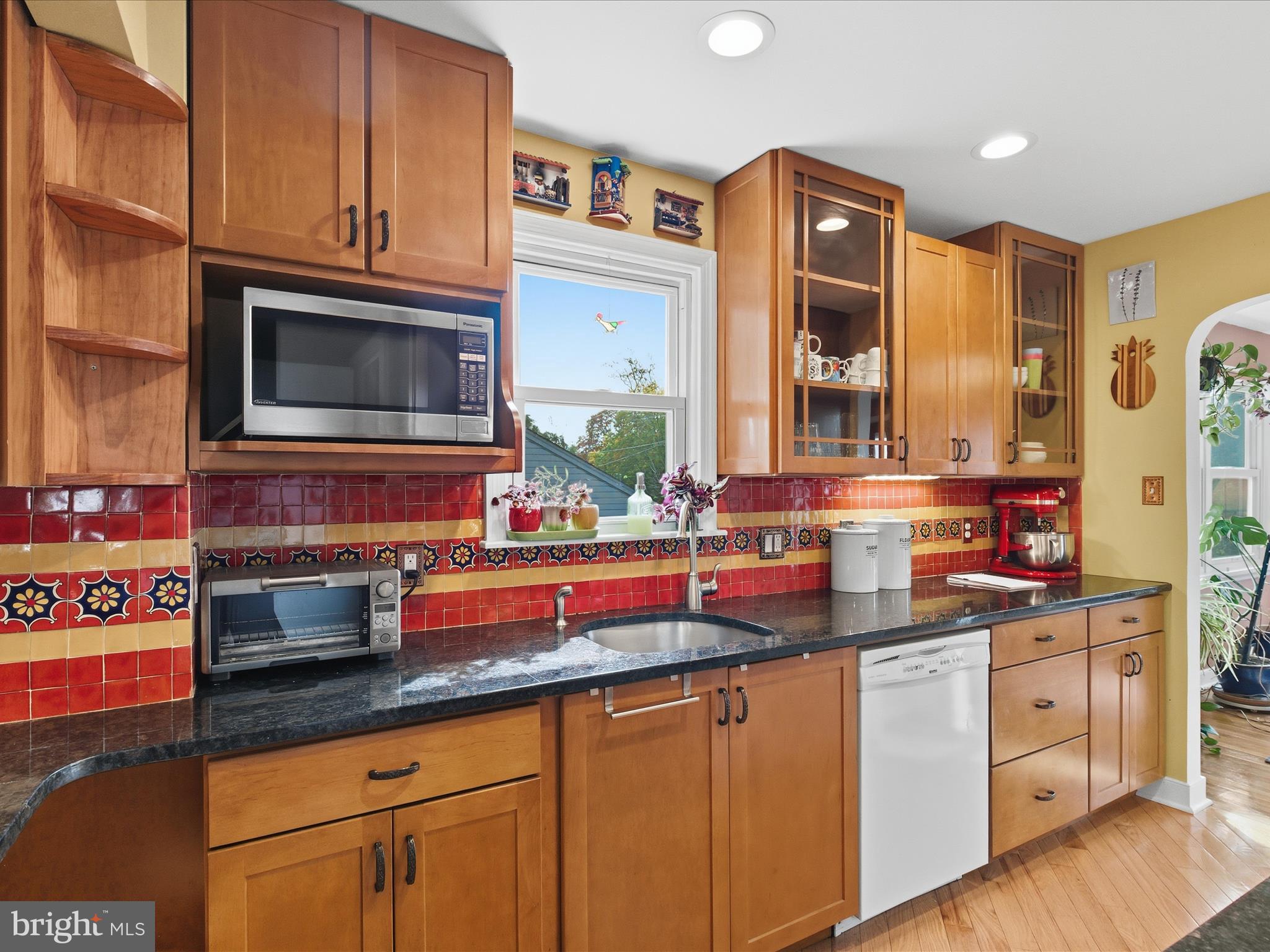 2707 Lindell Street Silver Spring, MD 20902 - Photo 13 of 51 a kitchen with stainless steel appliances granite countertop a sink and cabinets