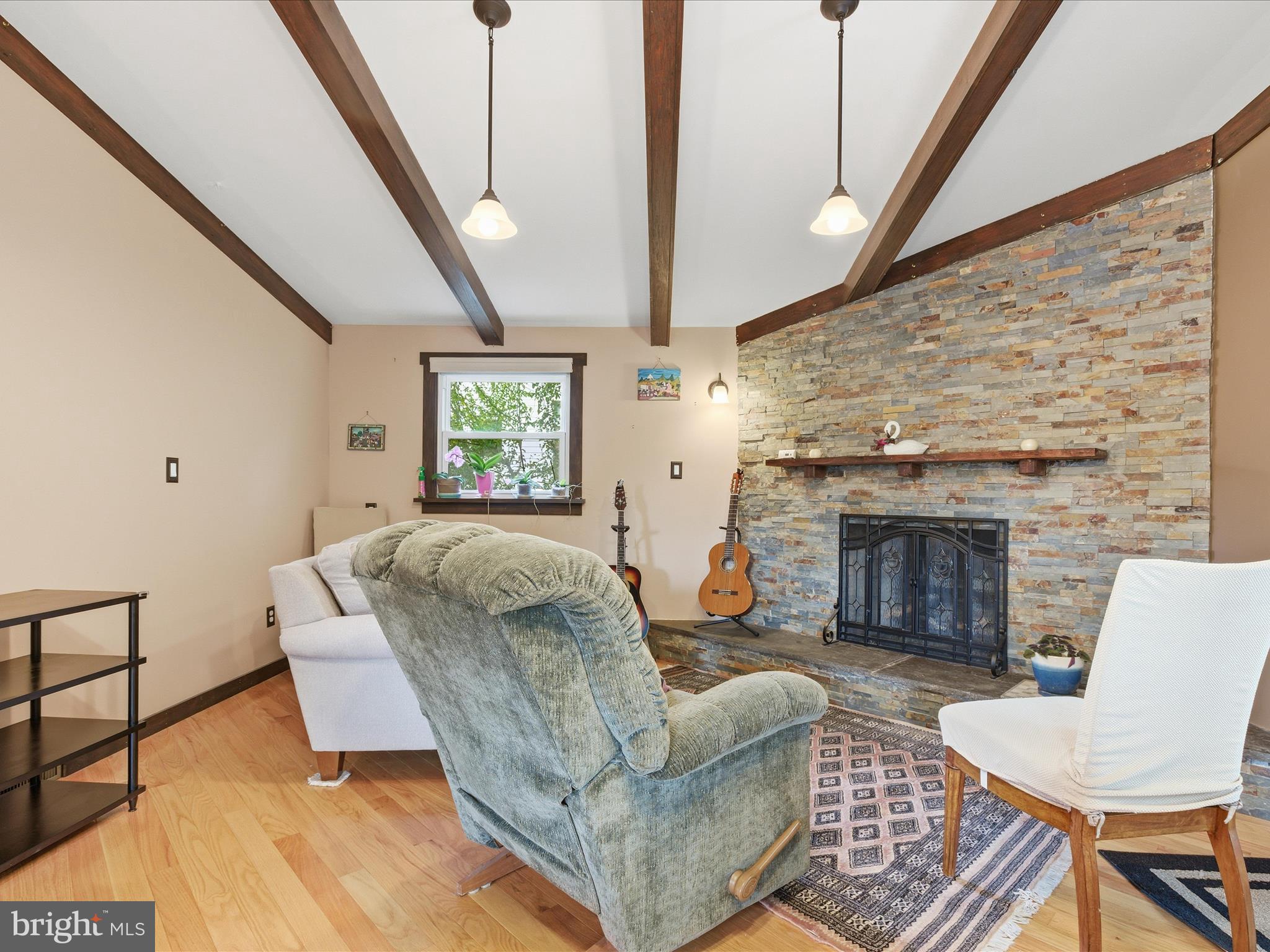 2707 Lindell Street Silver Spring, MD 20902 - Photo 17 of 51 a living room with furniture and a fireplace