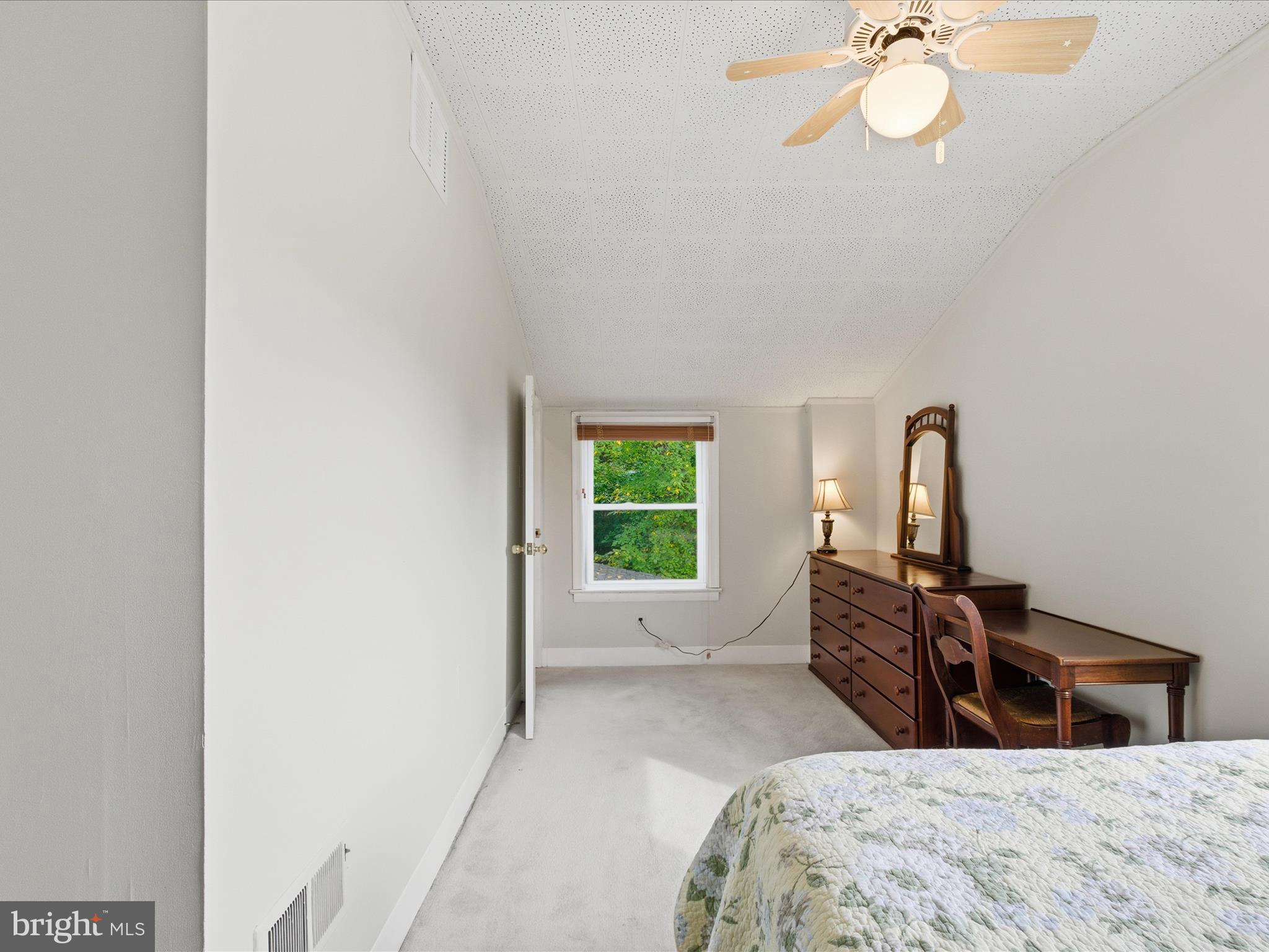 2707 Lindell Street Silver Spring, MD 20902 - Photo 33 of 51 a bedroom with a bed and a chandelier