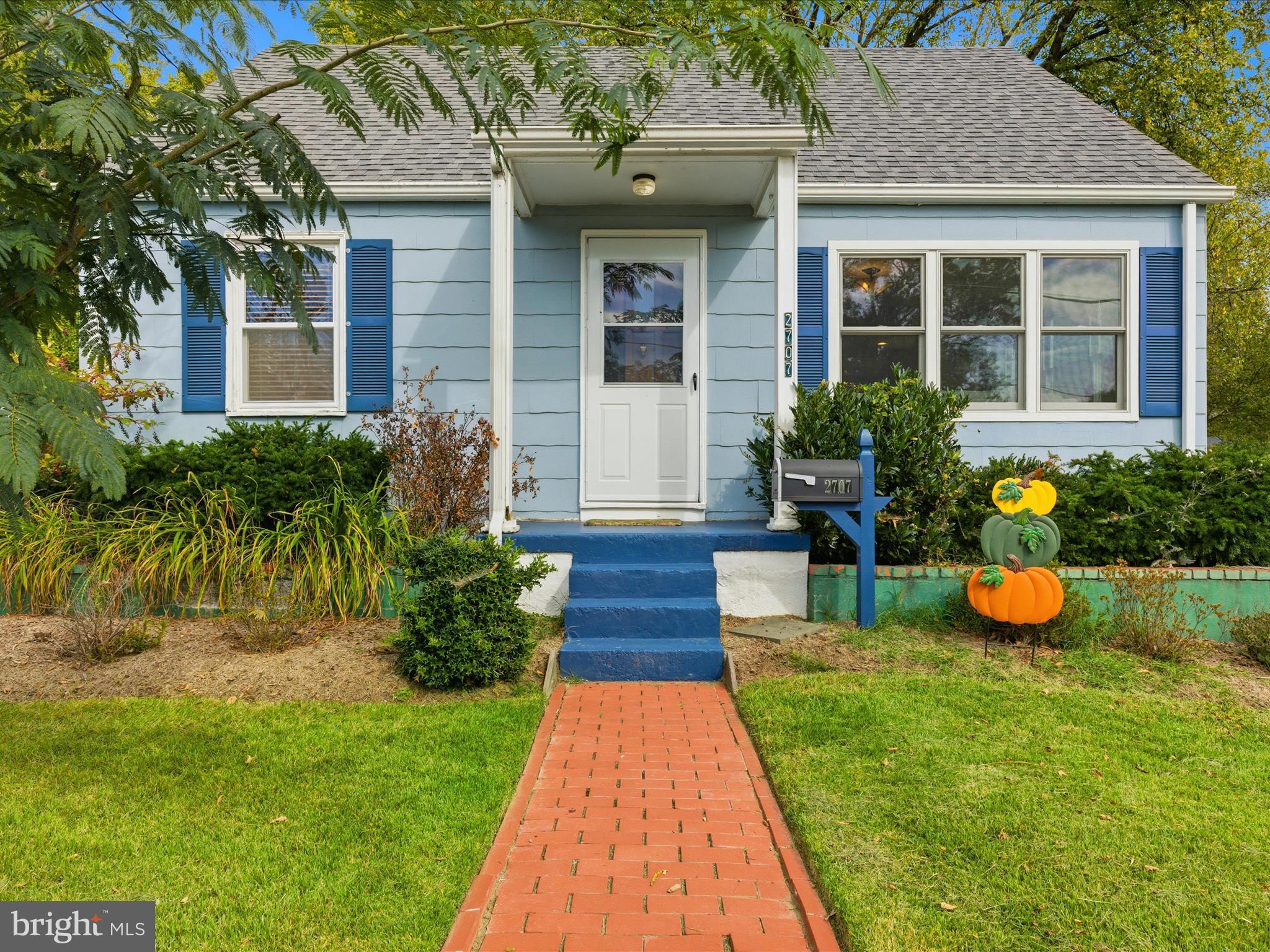 2707 Lindell Street Silver Spring, MD 20902 - Photo 4 of 51 a front view of a house with a yard and potted plants