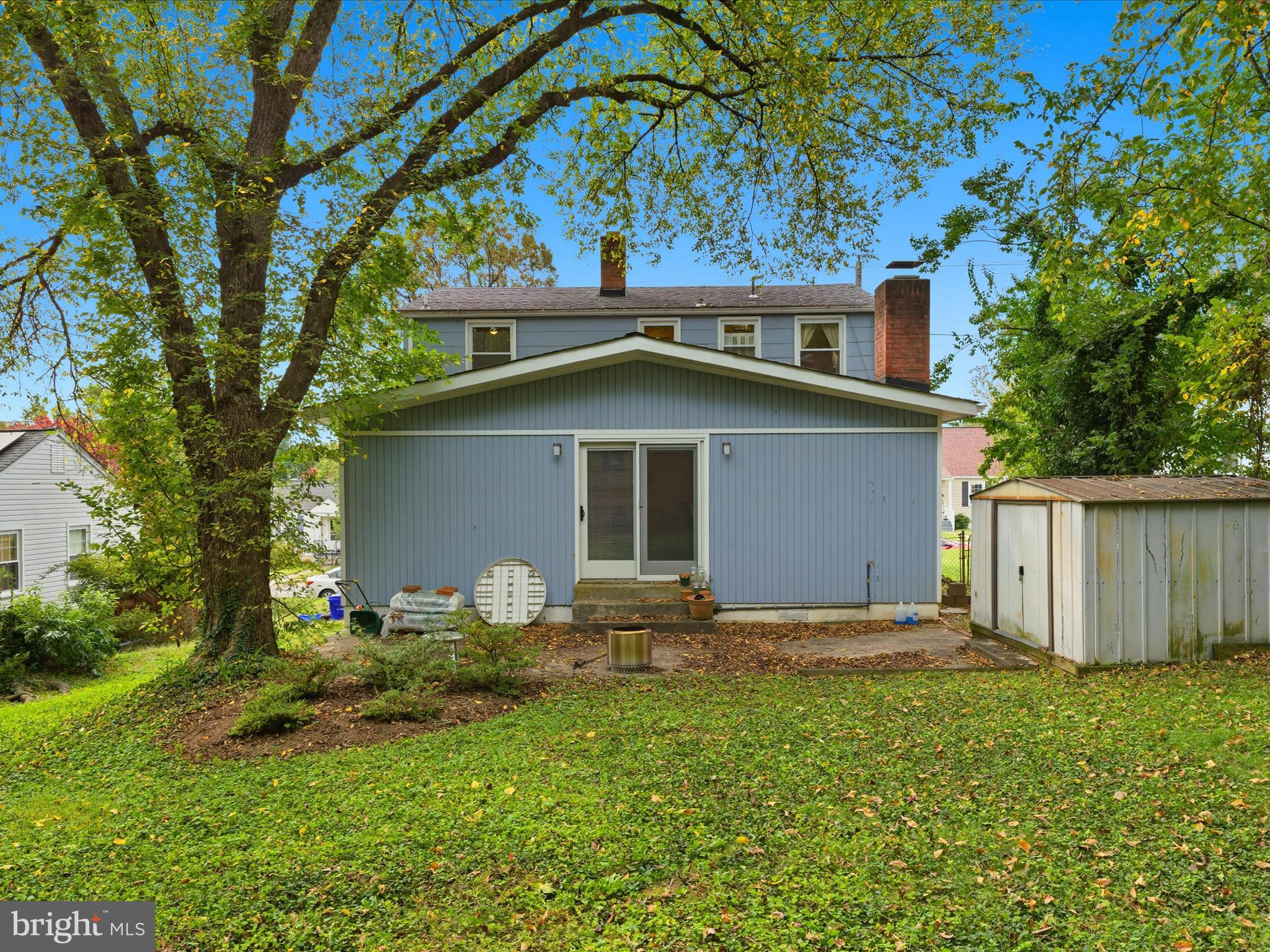 2707 Lindell Street Silver Spring, MD 20902 - Photo 42 of 51 a backyard of a house with table and chairs