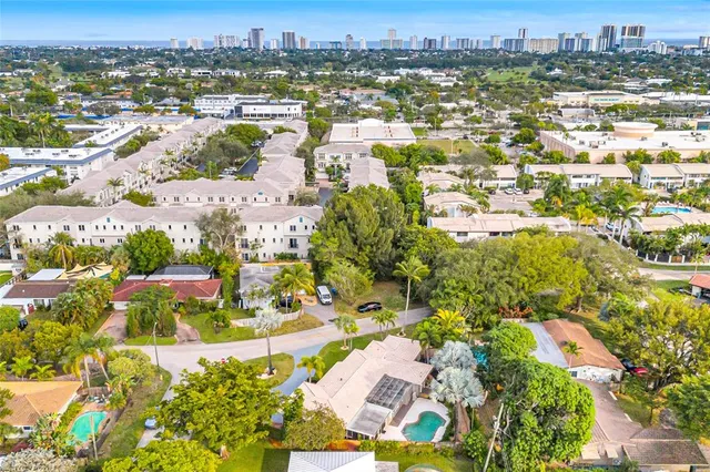 an aerial view of residential houses with outdoor space
