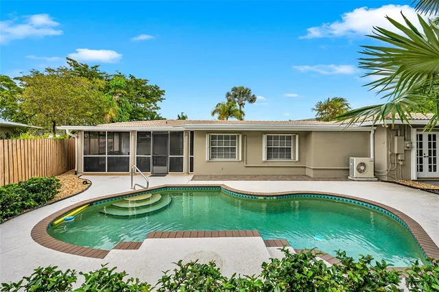 front view of a house with a swimming pool