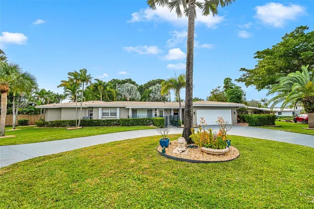 a front view of a house with a yard and porch