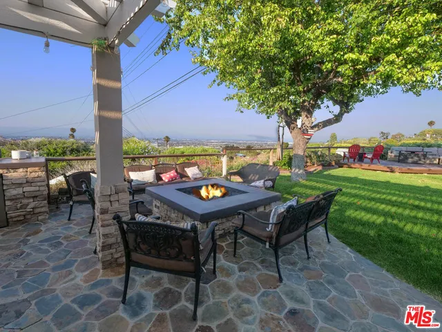 a backyard of a house with outdoor seating