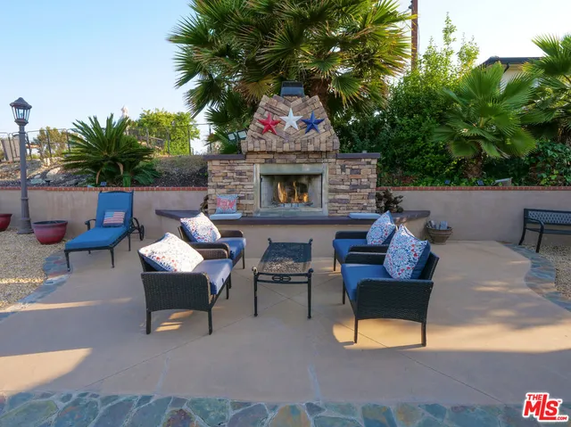 a view of a chairs and tables in the patio