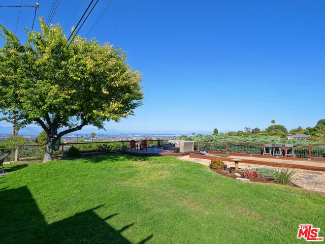 a view of a park with large trees
