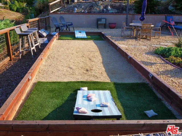 a view of swimming pool with outdoor seating