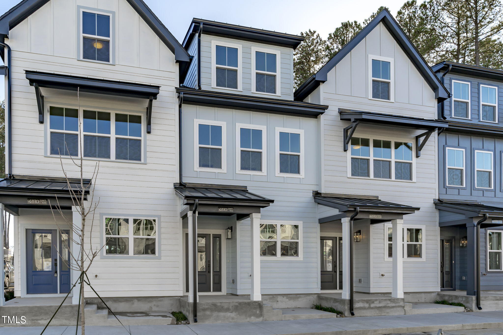4811 Gossamer Lane, Unit 102 Raleigh, NC 27616 - Photo 3 of 46 a front view of a house with glass windows