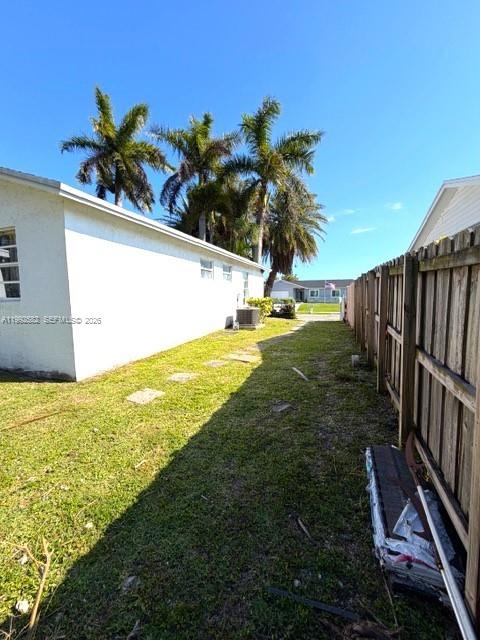 13041 Southwest 260th Terrace Homestead, FL 33032 - Photo 17 of 46 a view of an outdoor space and yard