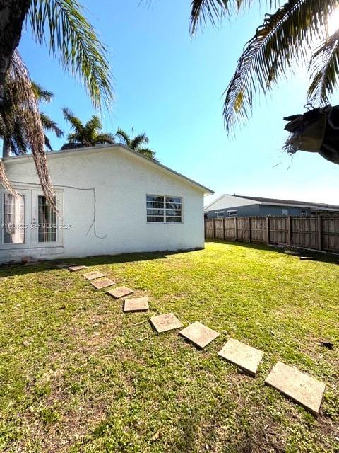 13041 Southwest 260th Terrace Homestead, FL 33032 - Photo 21 of 46 a front view of a house with swimming pool