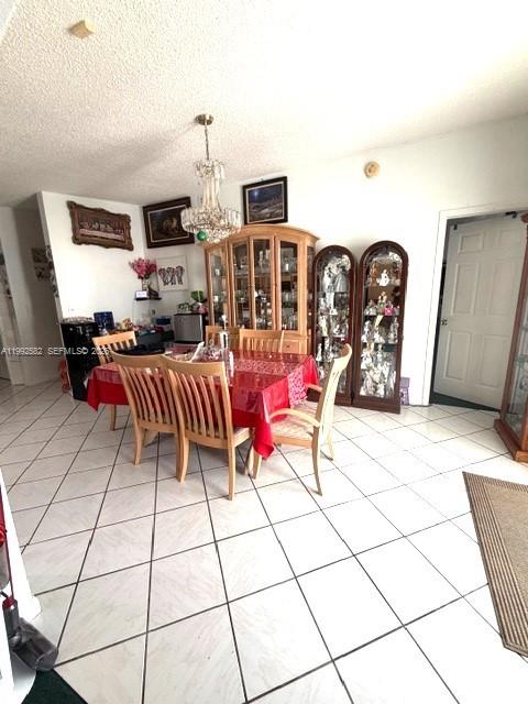 13041 Southwest 260th Terrace Homestead, FL 33032 - Photo 40 of 46 a living room with furniture a rug and white walls
