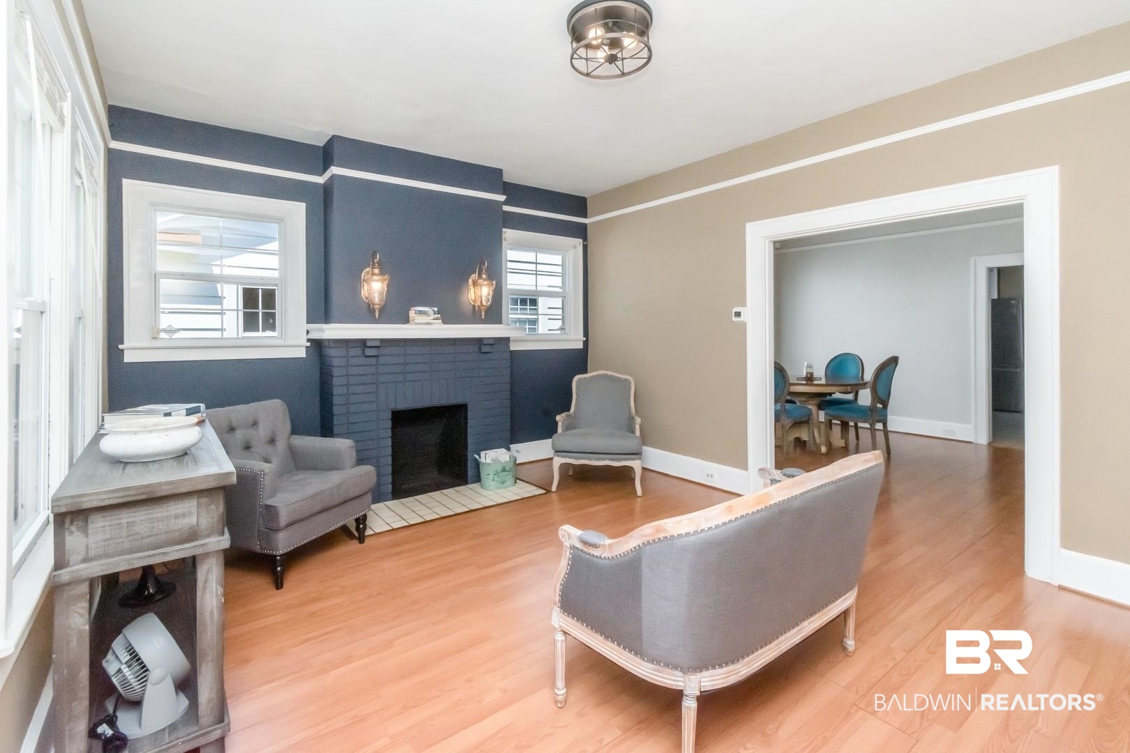 653 Cherokee Street Mobile, AL 36606 - Photo 2 of 22 Living area featuring wood finished floors and a fireplace